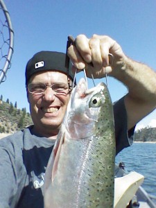 author with a big rainbow trout